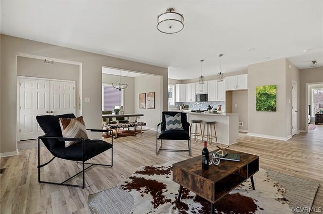 Open living area flowing into the dining room and kitchen